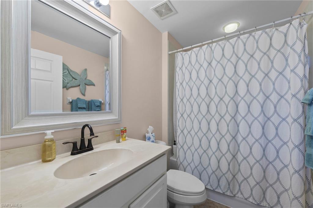 Full bath featuring vanity and toilet