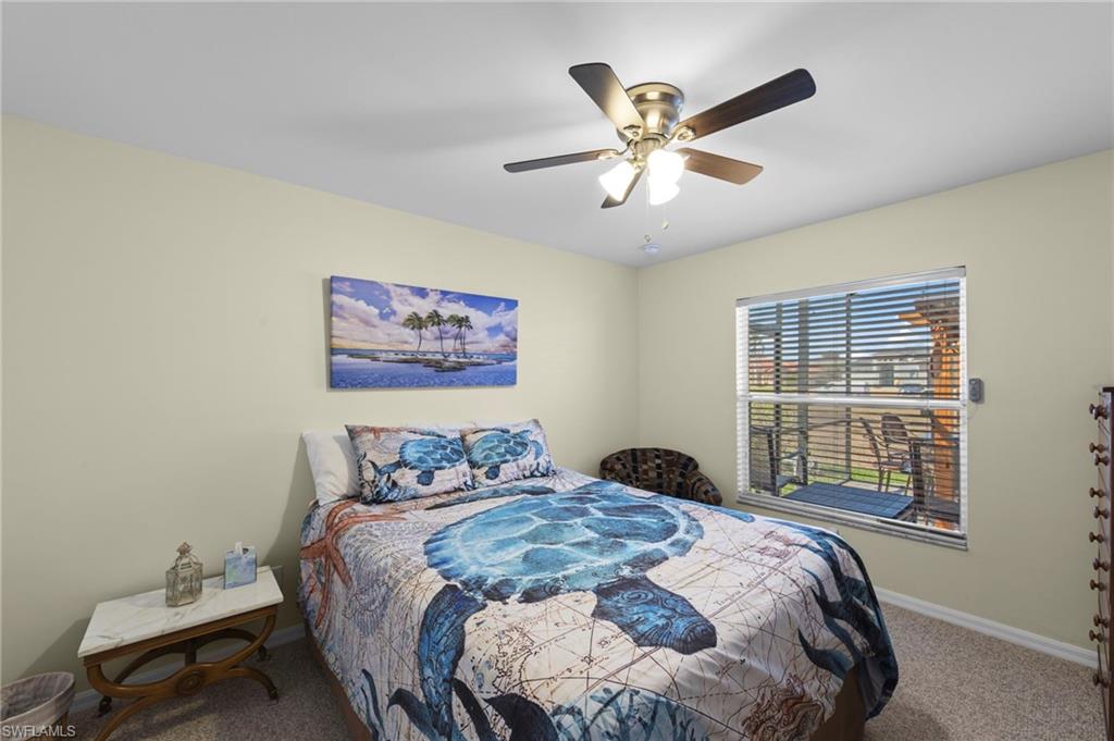 Bedroom featuring carpet and ceiling fan