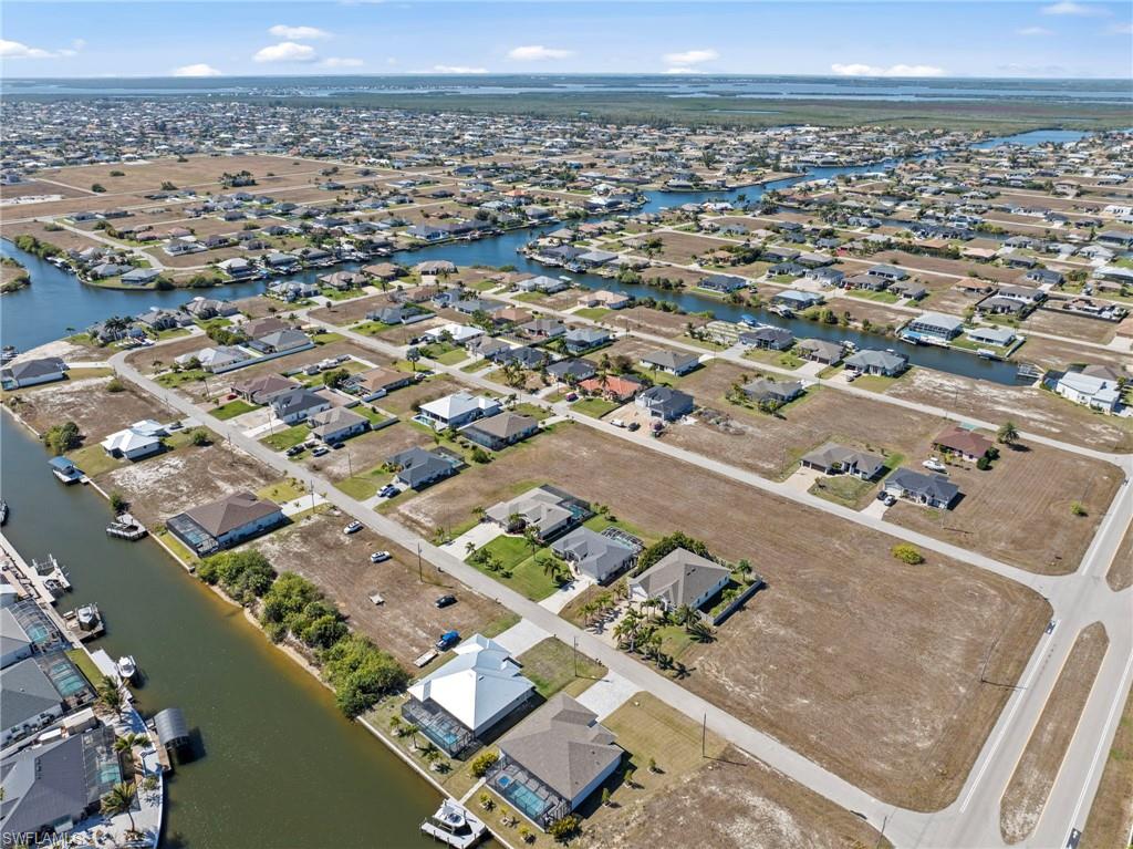 View of property location with nearby suburban area and a large body of water