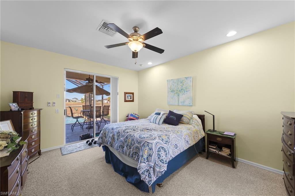 Bedroom featuring access to exterior, light colored carpet, ceiling fan, and recessed lighting
