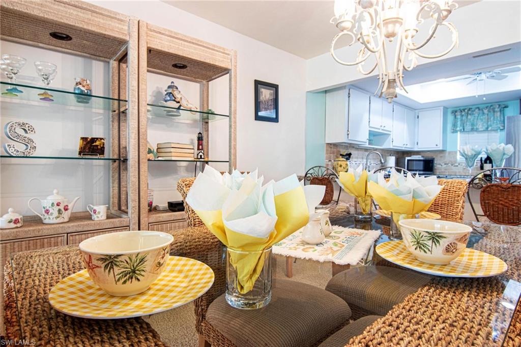 Dining space with a chandelier and a ceiling fan