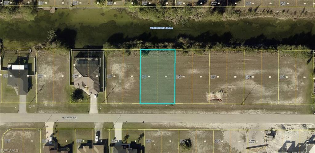 Aerial map of property and surrounding area featuring property parcel outlined
