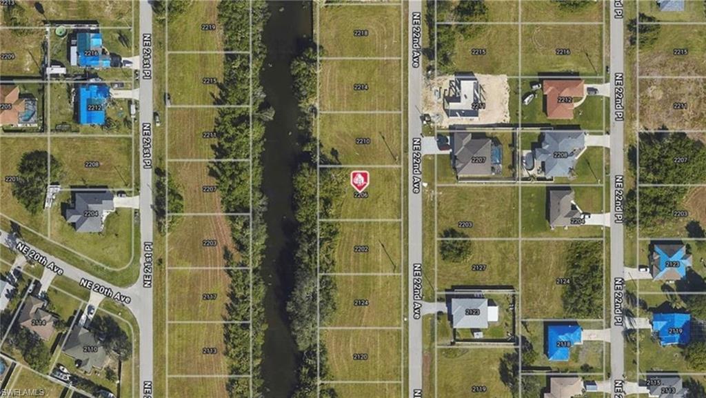 Aerial overview of property's location featuring property boundaries highlighted