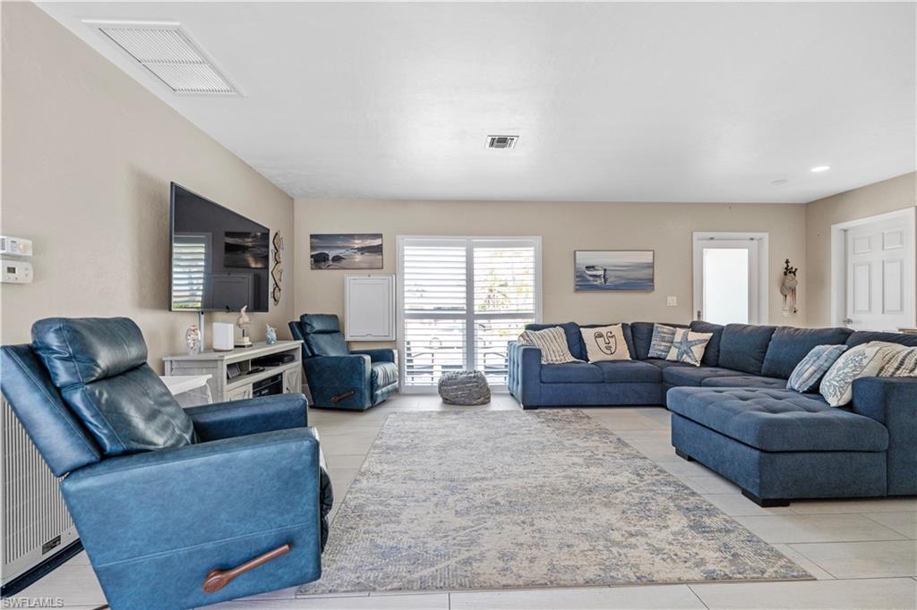 Living room featuring light tile patterned flooring