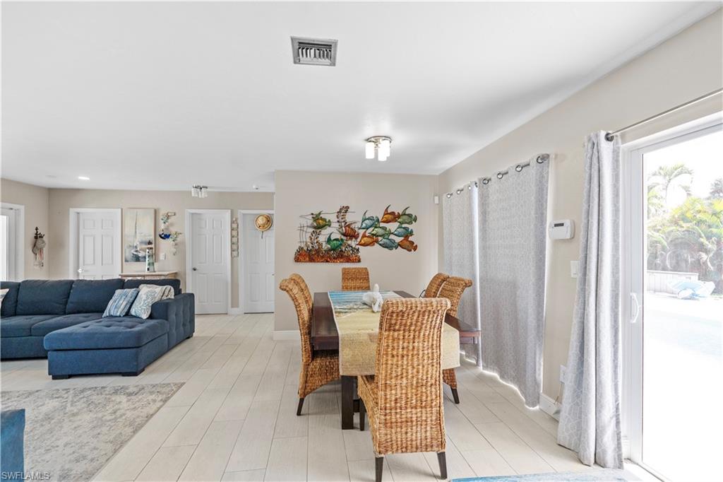 Dining space with baseboards and light wood finished floors