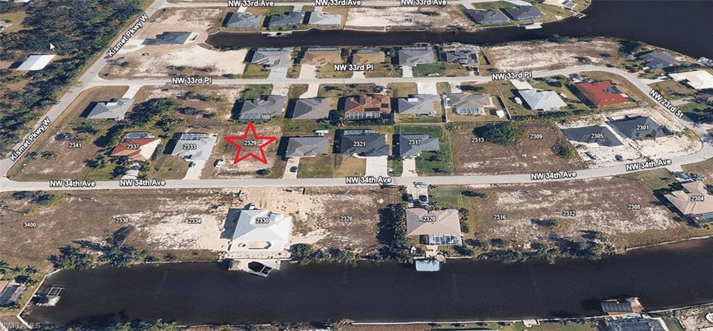 Aerial view of the property and the surrounding neighborhood.