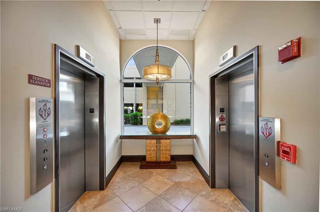 Kitchen featuring a paneled ceiling and elevator
