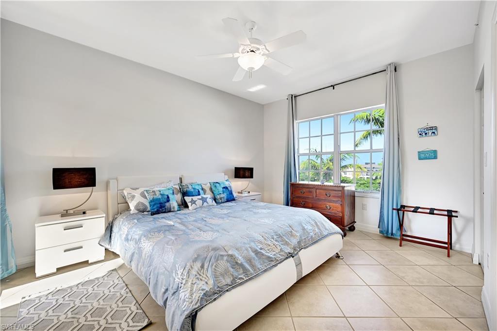 Bedroom featuring a ceiling fan and light tile patterned floors