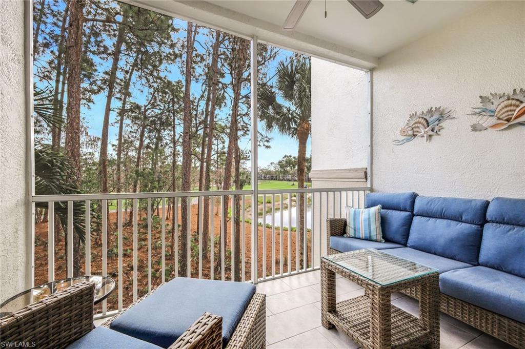 Balcony with outdoor lounge area and a ceiling fan