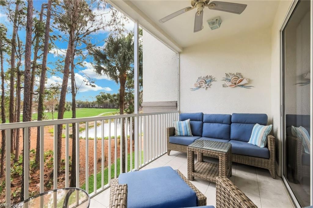 Balcony with ceiling fan, an outdoor lounge area, and view of golf course