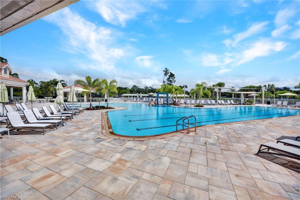 Community pool with a patio area