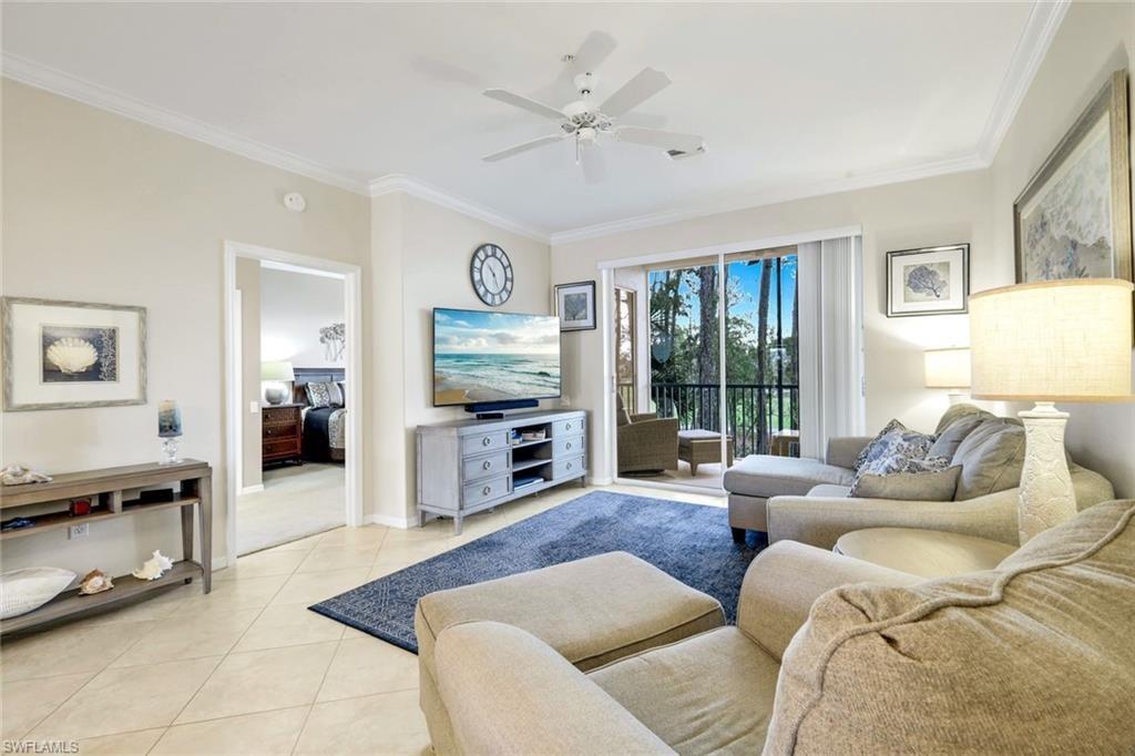 Living area featuring ceiling fan, crown molding, and light tile patterned flooring