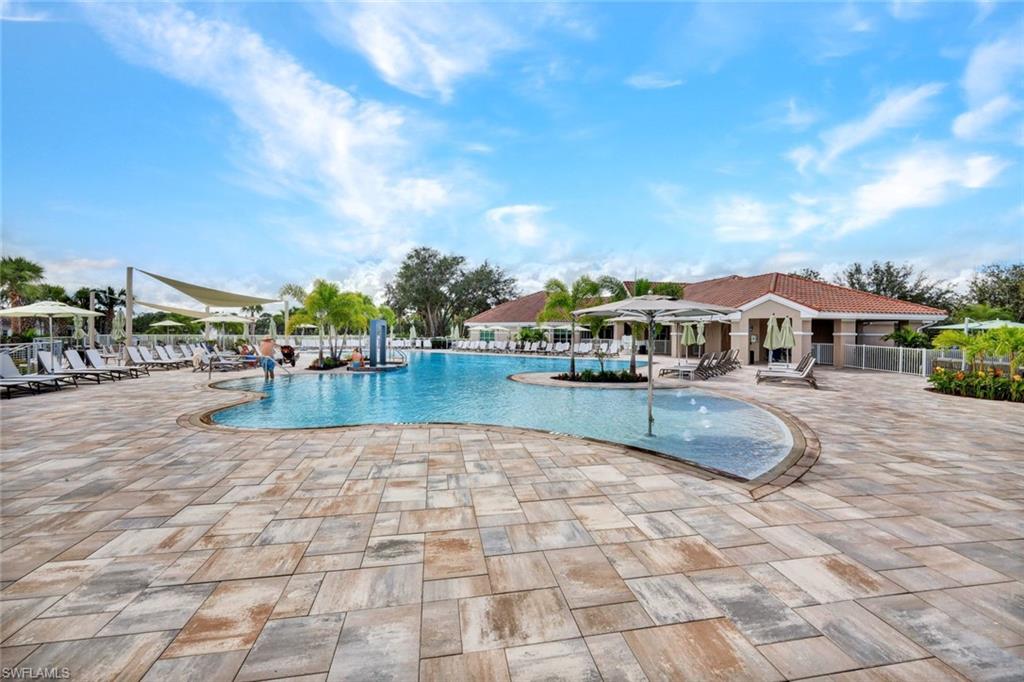 Community pool with a patio area