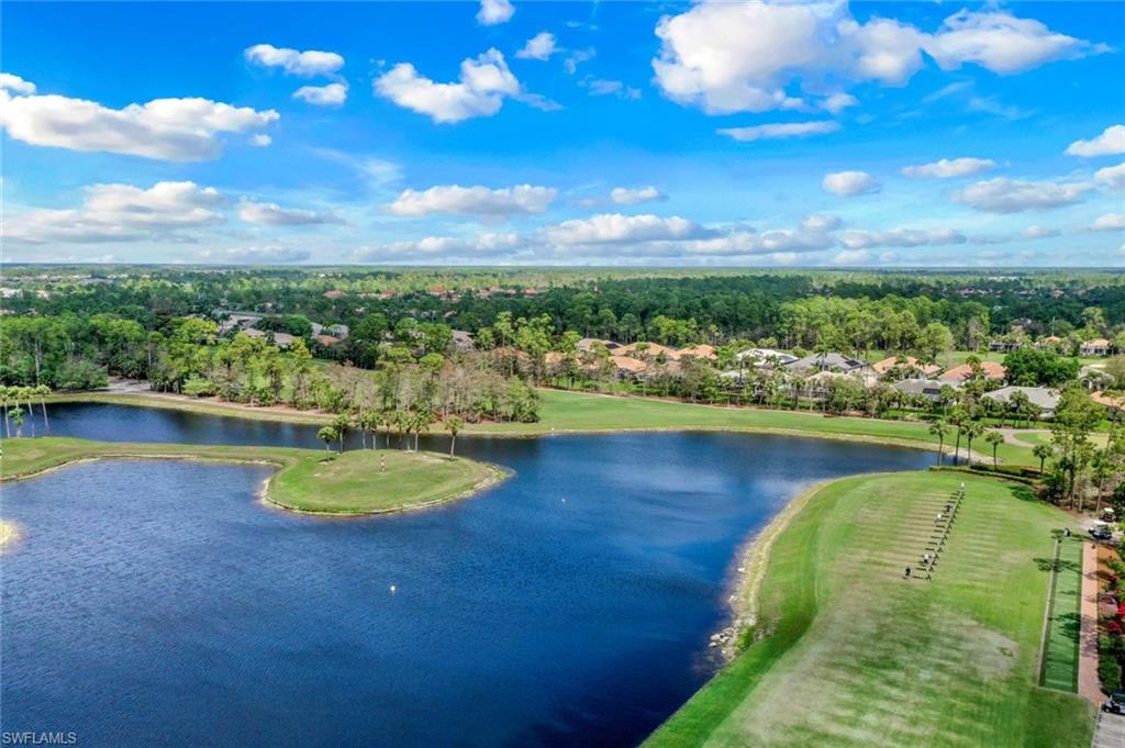 Drone / aerial view of a large body of water and a local golf course