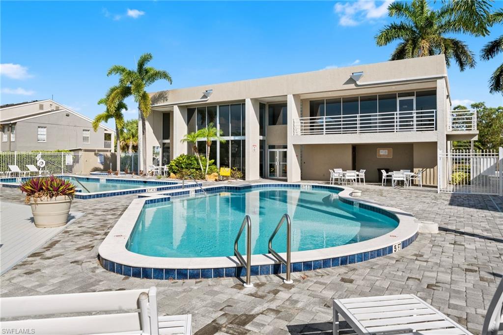 Community pool featuring a patio area