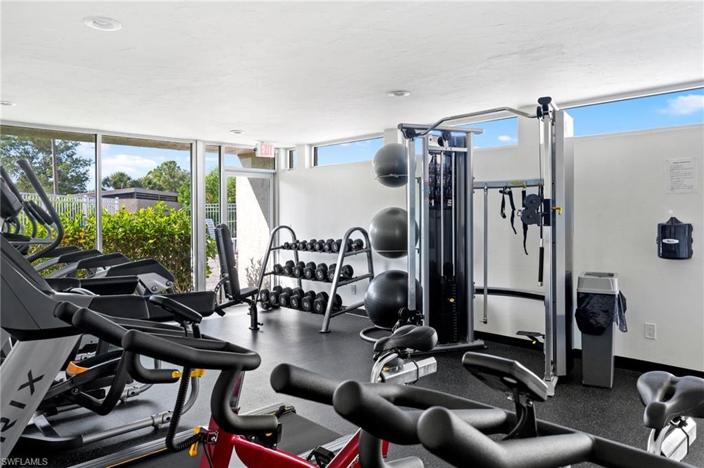 Workout area featuring floor to ceiling windows