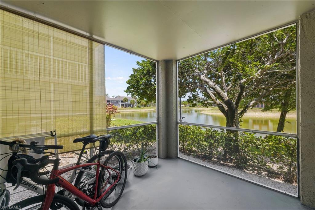 Unfurnished sunroom with a water view