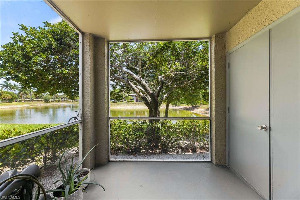 Unfurnished sunroom featuring a water view and plenty of natural light
