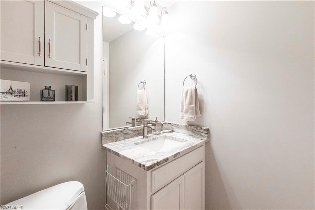 Bathroom featuring vanity and toilet