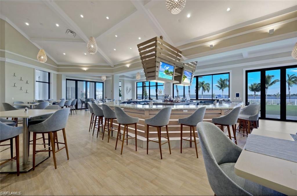Dining room featuring light wood-style flooring, recessed lighting, and lofted ceiling