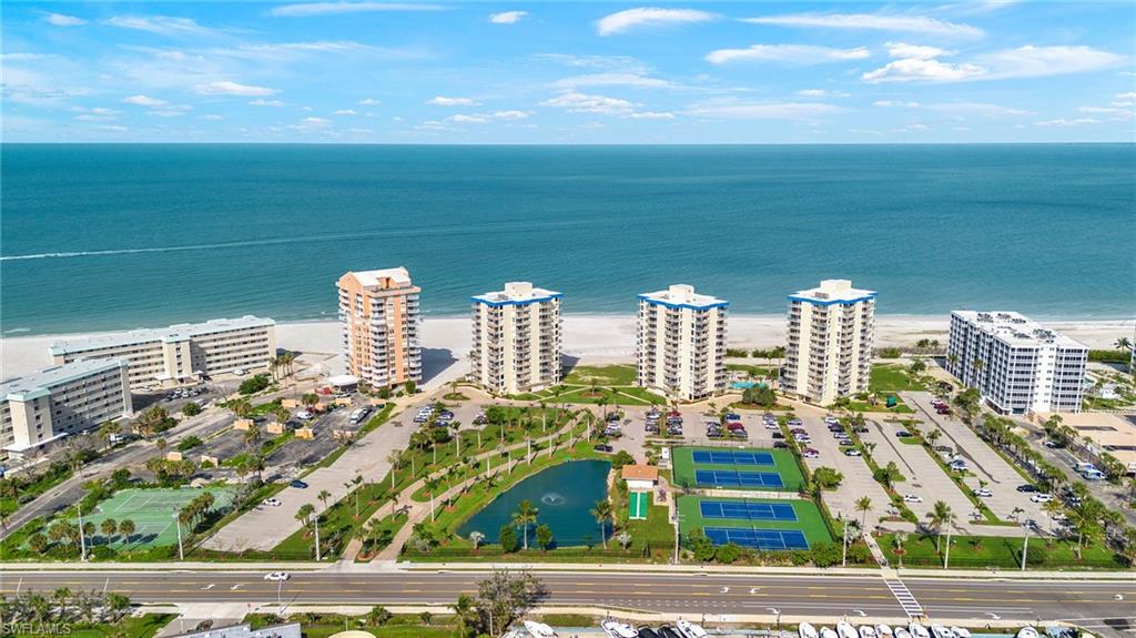 Bird's eye view of a large body of water and apartment complex