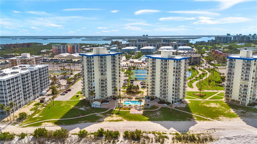 View of urban area featuring a nearby body of water and a pool