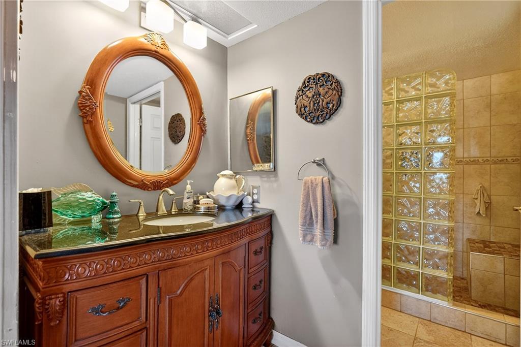 Full bath with vanity and a walk in shower