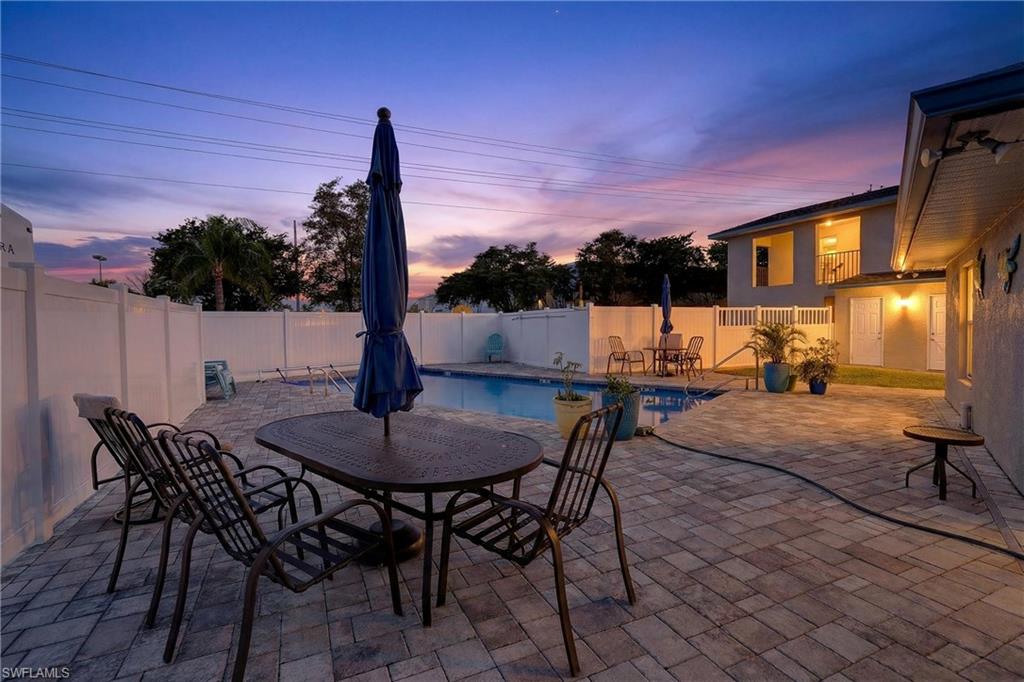 Fenced backyard with a patio area