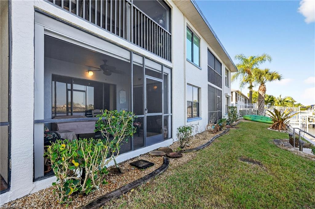 View of yard featuring a sunroom