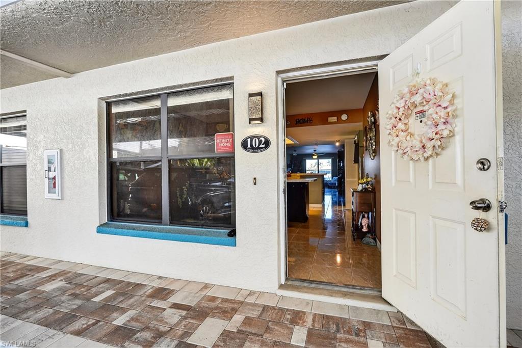 Property entrance with stucco siding