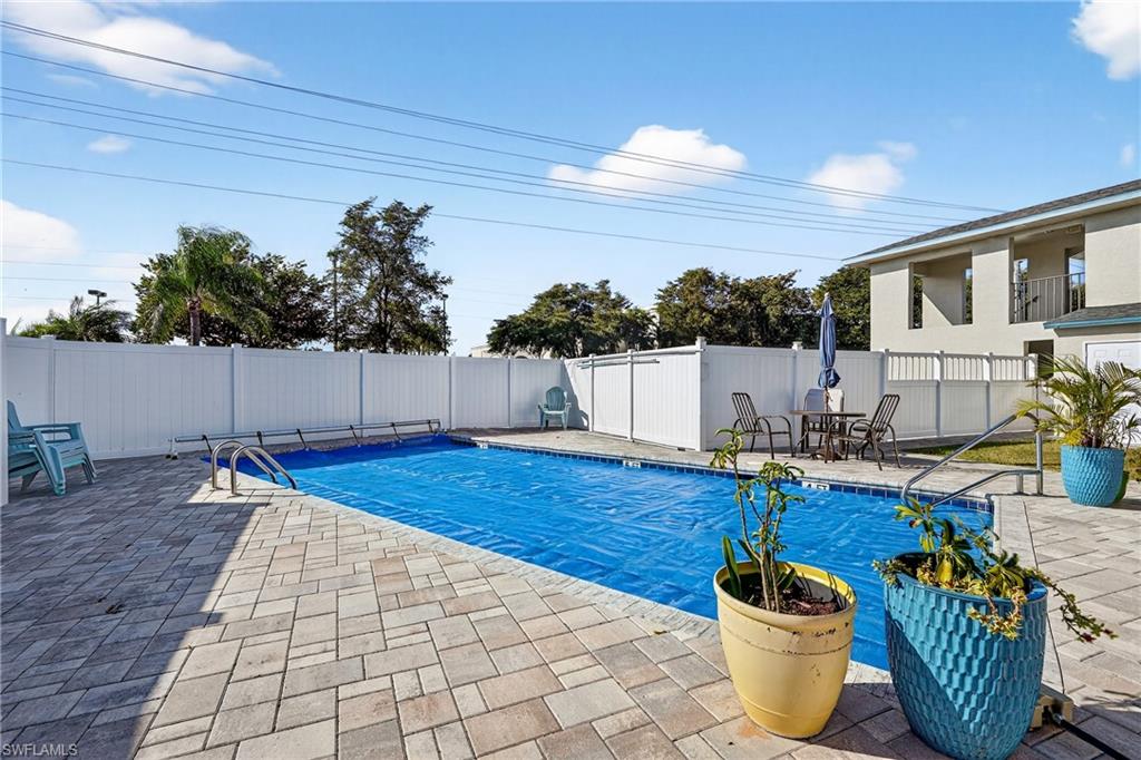 Community pool with a patio