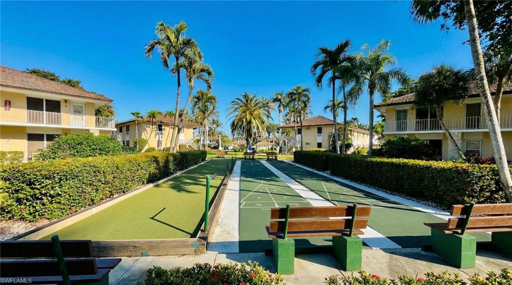 View of home's community with shuffleboard and a residential view