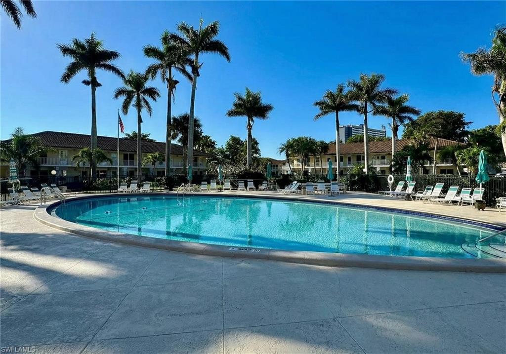 Community pool with a patio area