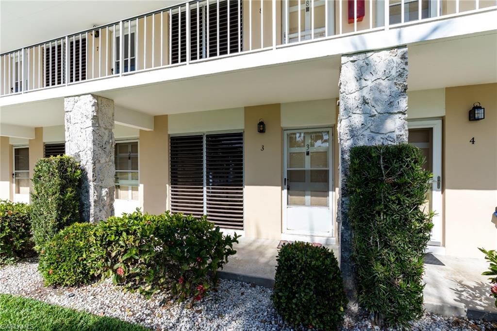Entrance to property featuring stucco siding