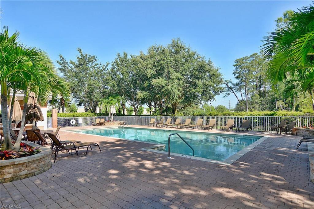Community pool with a patio