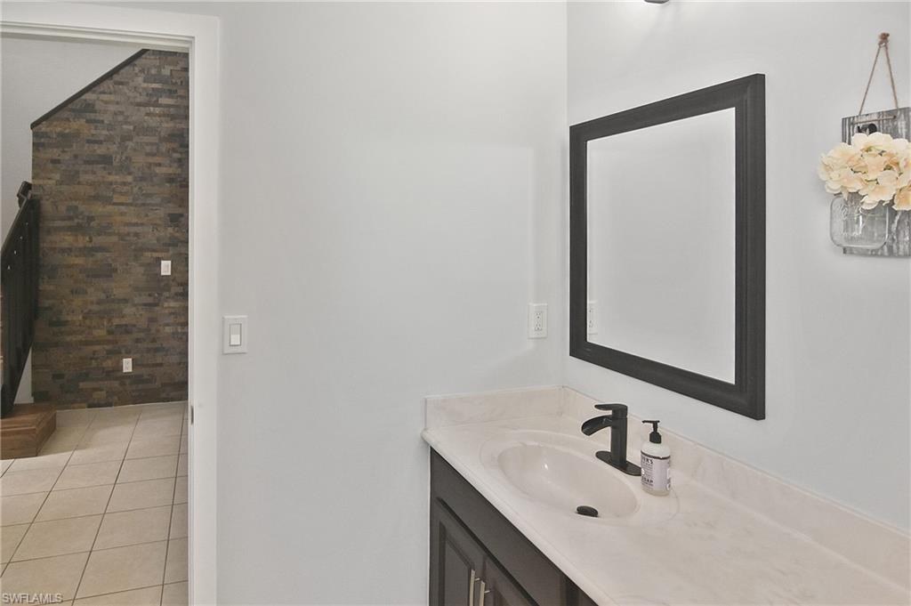 Bathroom featuring vanity and light tile patterned floors