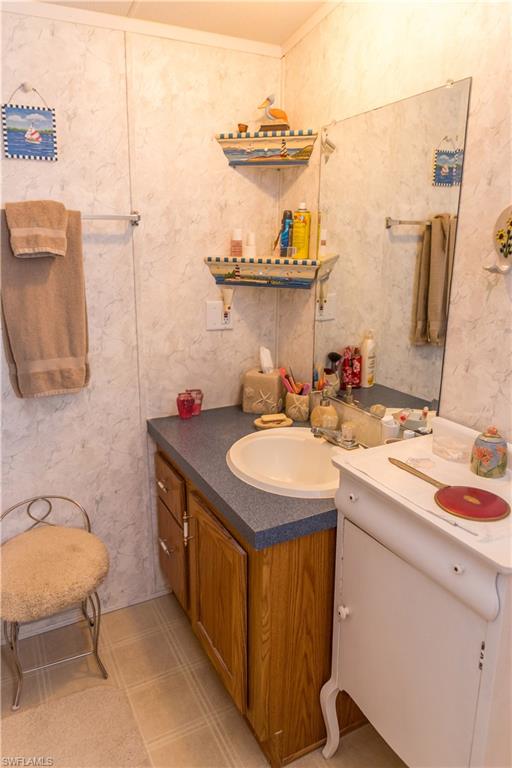 Half bath with vanity and ornamental molding
