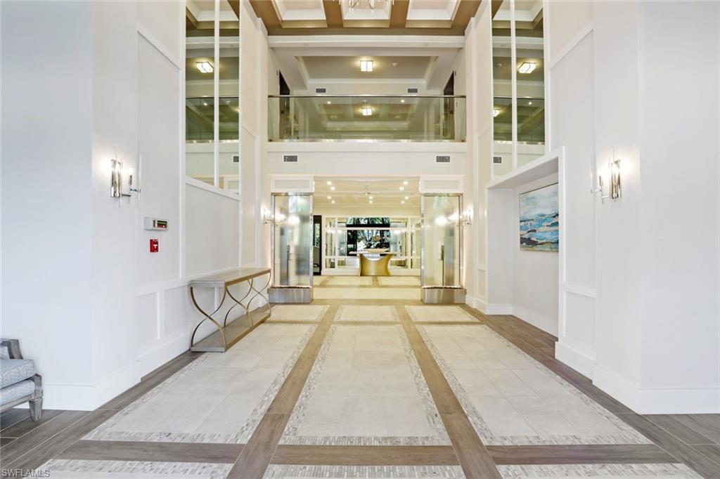 Building lobby with a high ceiling and a decorative wall