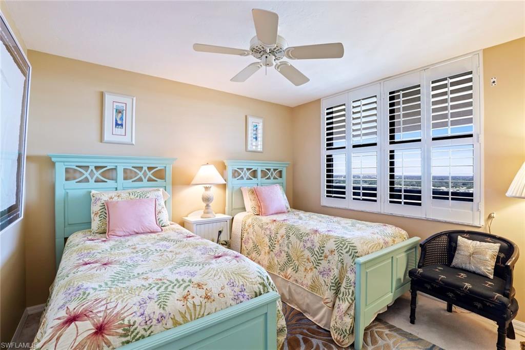 Bedroom featuring ceiling fan and baseboards