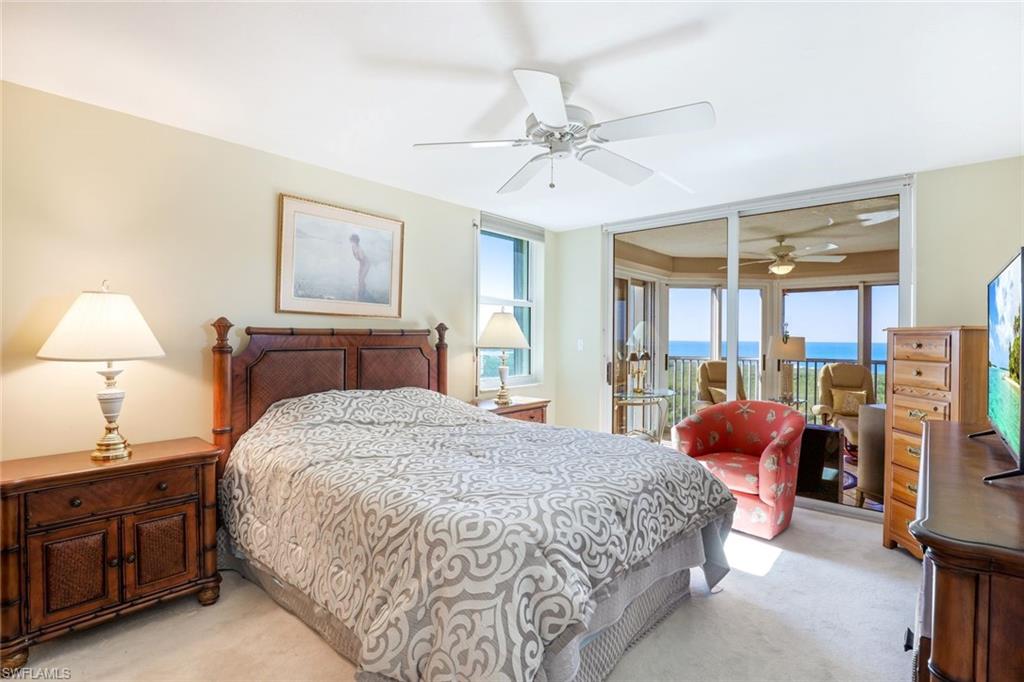 Bedroom with light carpet, access to outside, and ceiling fan