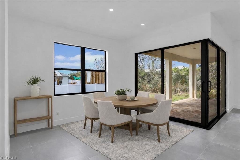 Dining area featuring baseboards and recessed lighting. This photo was digitally staged.