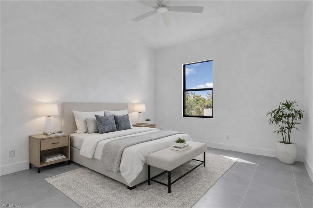 Bedroom featuring baseboards and a ceiling fan. This photo was digitally staged.