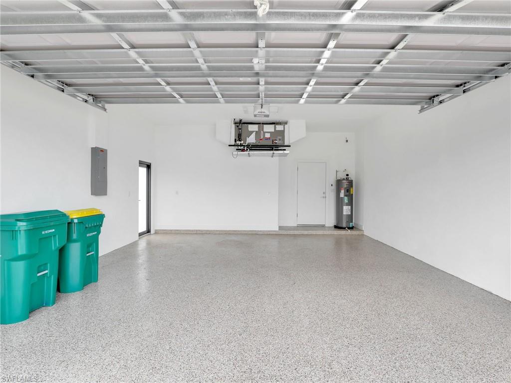 Garage with electric panel and electric water heater