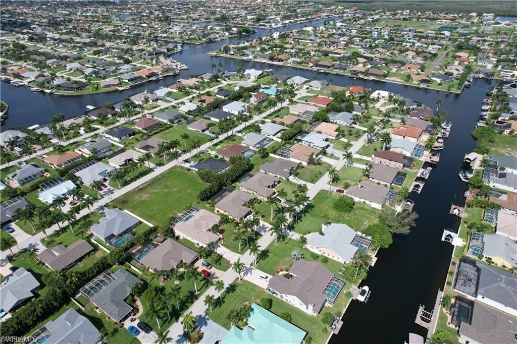 View of property location featuring a large body of water and nearby suburban area