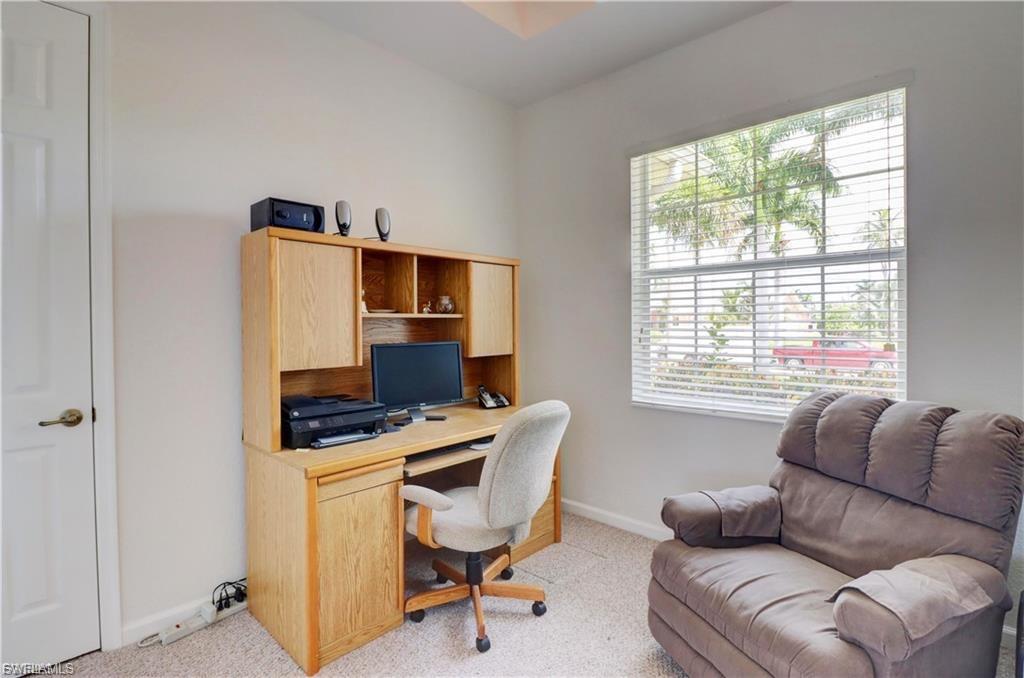 Office space featuring light carpet and baseboards