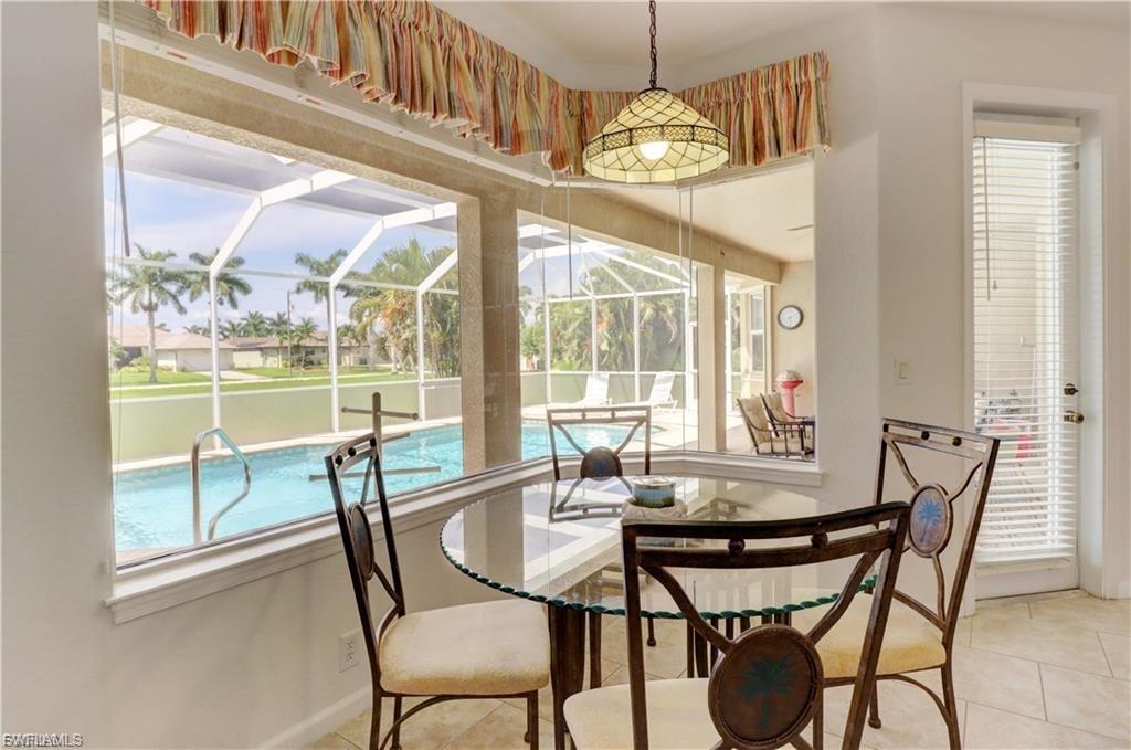 Dining room featuring a sunroom and tile patterned floors