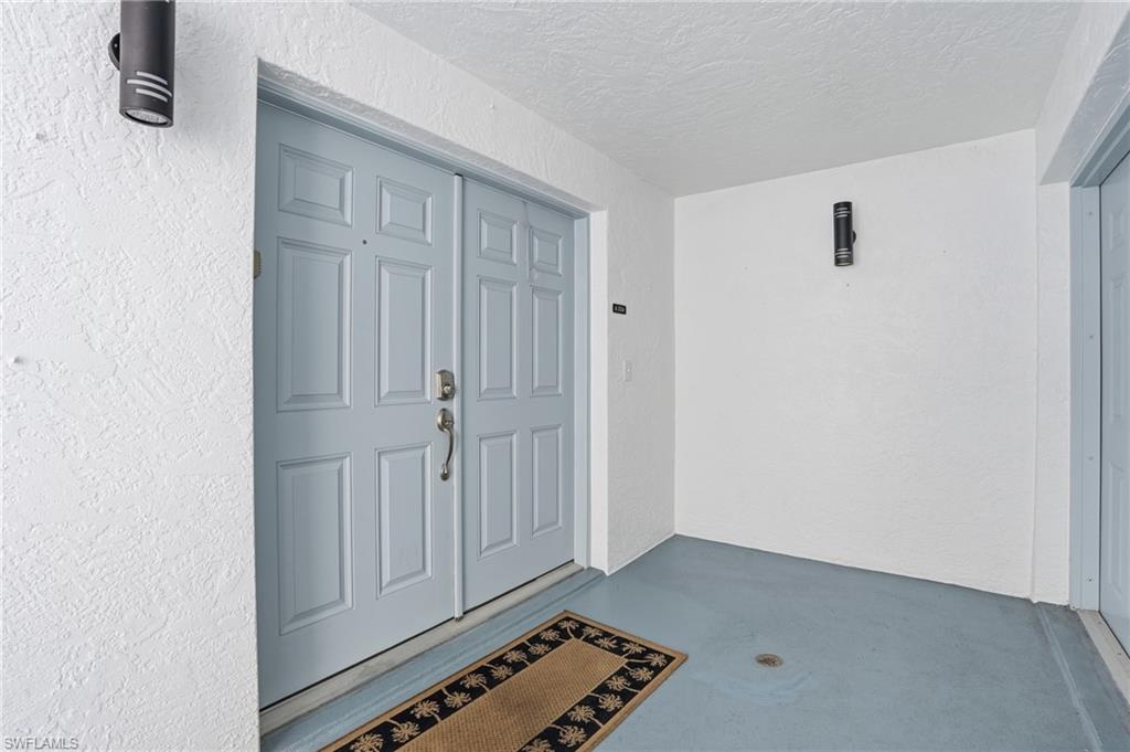 Property entrance with stucco siding - Virtually Edited Image