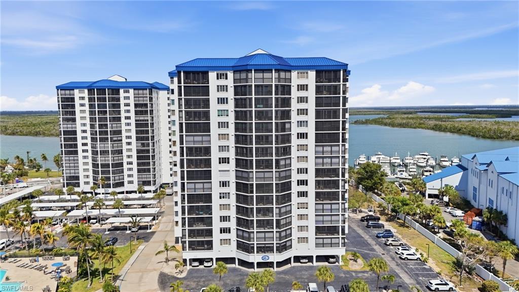 View of apartment building / complex with a water view - Virtually Edited Image