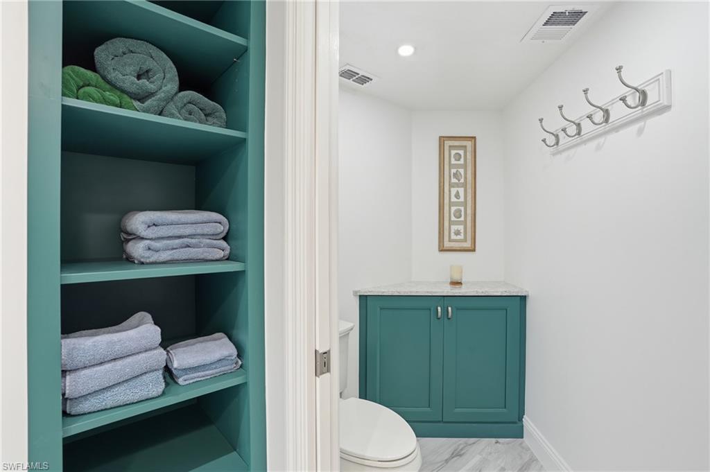 Bathroom with toilet and vanity - Virtually Edited Image