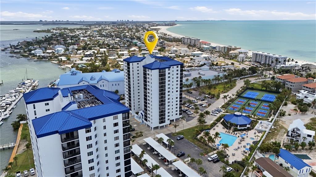 Drone / aerial view of a nearby body of water and apartment complex - Virtually Edited Image